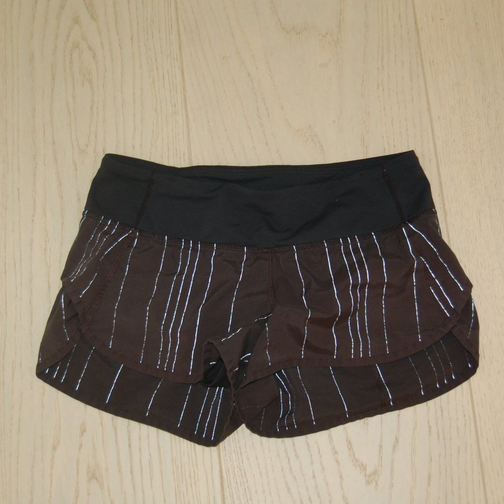 Black Lululemon shorts, size 4, silver/white accents